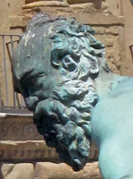 This is one of the water nymphs surrounding Neptune, who stand in the middle of the fountain.